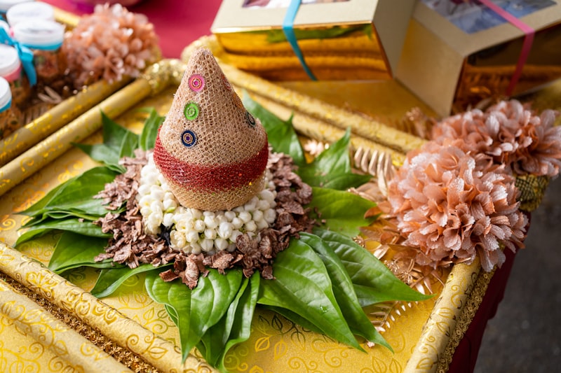Thamboolam arrangement with betel leaves, coconut, and jasmine on a ceremonial plate